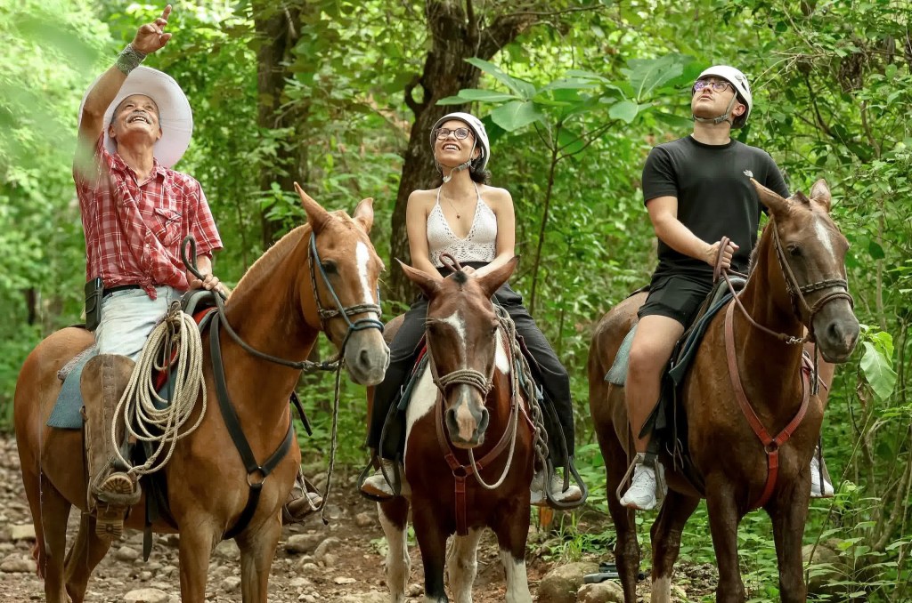 Family enjoying horseback riding during the Rincón Day Pass adventure activities